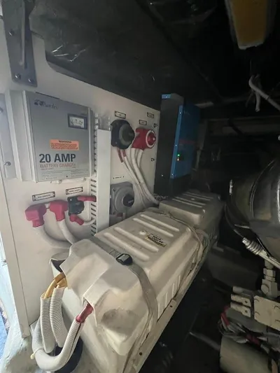 Roweboat Yacht Photos Pics 2006 Carver Voyager engine room with battery charger and electrical components.