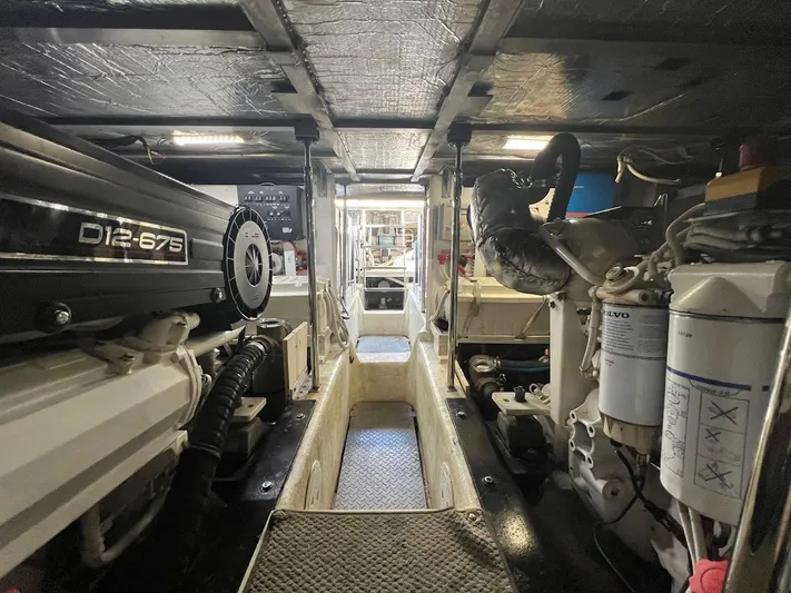 Roweboat Yacht Photos Pics Engine room of a 2006 Carver Voyager, featuring D12-675 engines and mechanical components.