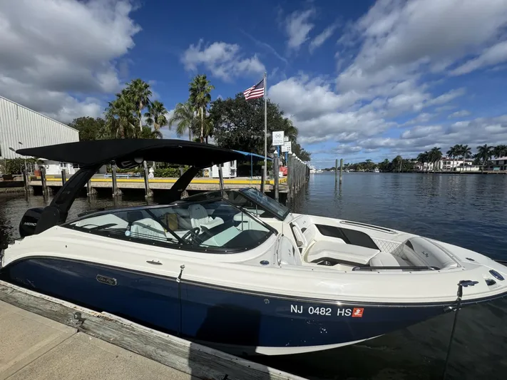 Double Trouble Yacht Photos Pics 2023 Sea Ray 260 SLX boat docked by a scenic waterfront.