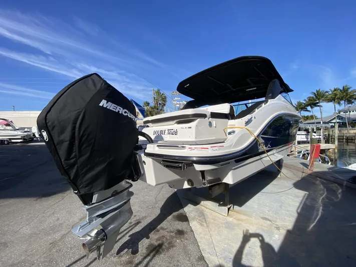 Double Trouble Yacht Photos Pics 2023 Sea Ray 260 SLX boat with Mercury engine at a marina.