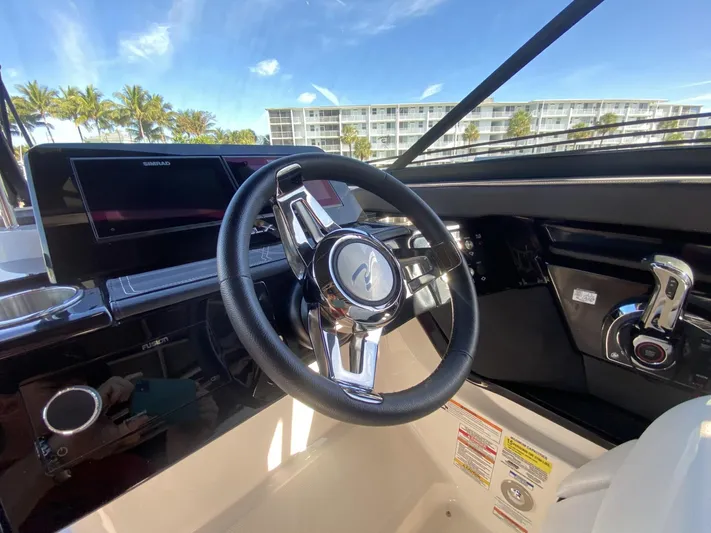 Double Trouble Yacht Photos Pics 2023 Sea Ray 260 SLX boat dashboard with steering wheel and controls.