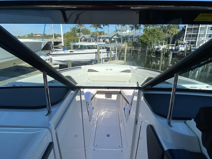 Double Trouble Yacht Photos Pics 2023 Sea Ray 260 SLX boat interior with marina view.