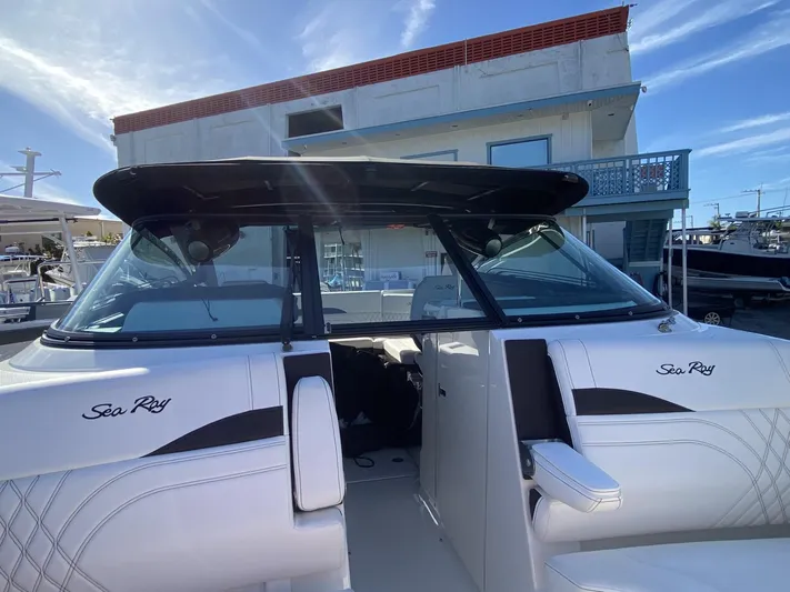 Double Trouble Yacht Photos Pics 2023 Sea Ray 260 SLX boat with sleek design, docked under a clear blue sky.