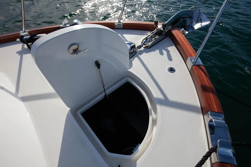 Mareluna Yacht Photos Pics Open hatch on 2023 Vicem 55 yacht deck, with wooden trim and ocean view.