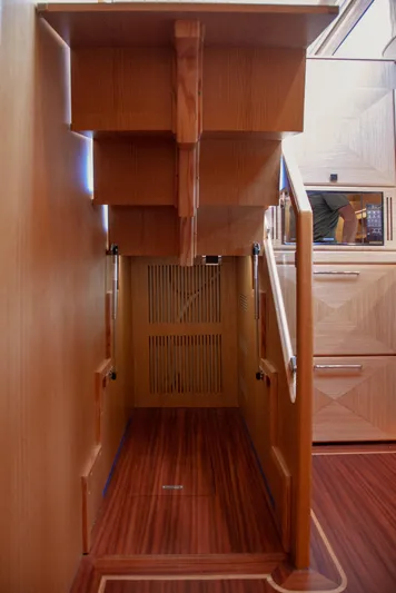 Mareluna Yacht Photos Pics Interior of 2023 Vicem 55 yacht, featuring wooden stairs and elegant cabinetry.