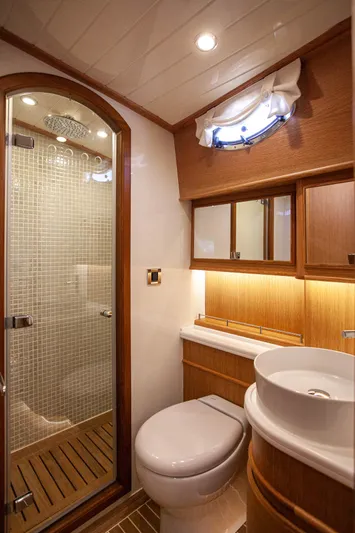Mareluna Yacht Photos Pics Luxurious bathroom in 2023 Vicem 55 yacht with modern fixtures and elegant wood accents.