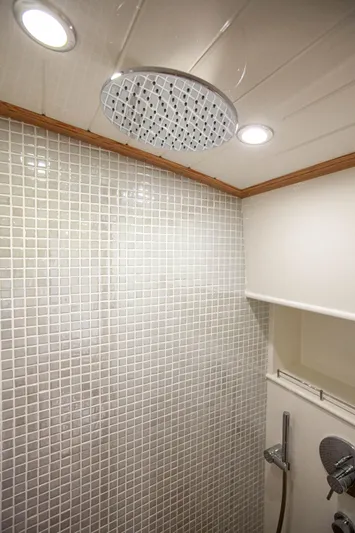 Mareluna Yacht Photos Pics Luxurious shower area in 2023 Vicem 55 yacht with modern fixtures and tiled walls.
