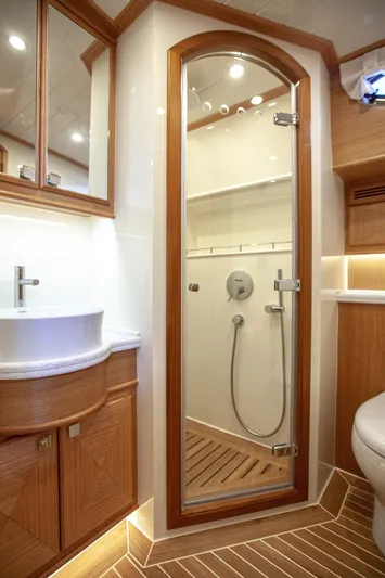 Mareluna Yacht Photos Pics Luxurious bathroom in 2023 Vicem 55 yacht with modern fixtures and wooden accents.