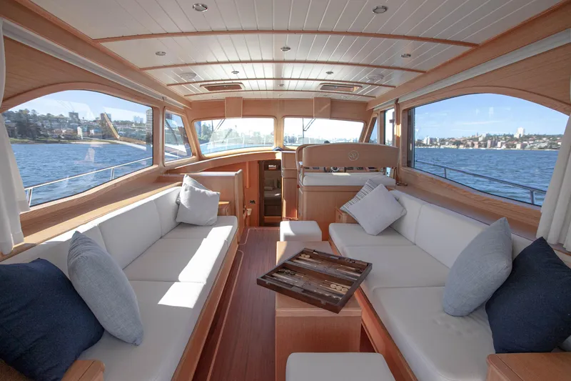 Mareluna Yacht Photos Pics Luxurious interior of 2023 Vicem 55 yacht with elegant seating and scenic water views.