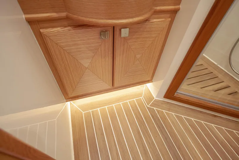 Mareluna Yacht Photos Pics Luxurious wood interior of 2023 Vicem 55 yacht with elegant cabinetry and flooring.