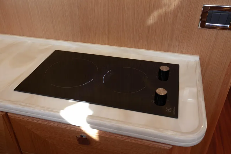 Mareluna Yacht Photos Pics Modern stovetop in 2023 Vicem 55 yacht kitchen, featuring sleek design and dual burners.