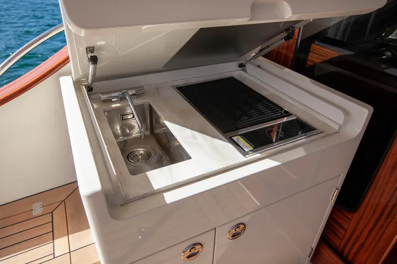 Mareluna Yacht Photos Pics Outdoor kitchenette on 2023 Vicem 55 yacht with sink and grill.