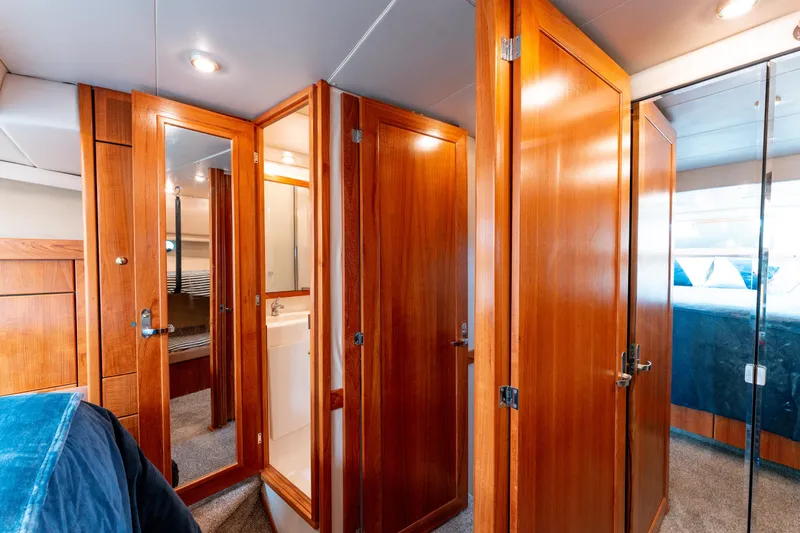 Seaclusion Yacht Photos Pics Interior of 1998 Bayliner 4788 Pilot House Motoryacht with wooden doors and cozy cabin.