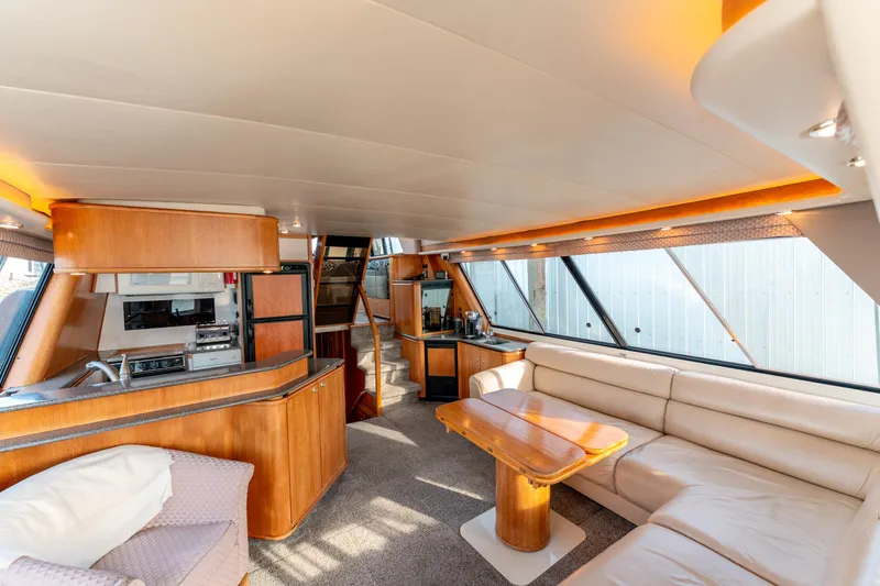 Seaclusion Yacht Photos Pics Luxurious interior of 1998 Bayliner 4788 Pilot House Motoryacht with modern furnishings and ample seating.