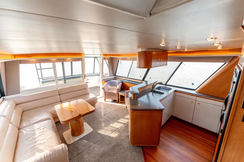 Seaclusion Yacht Photos Pics Luxurious interior of 1998 Bayliner 4788 Pilot House Motoryacht with spacious seating and modern kitchen.