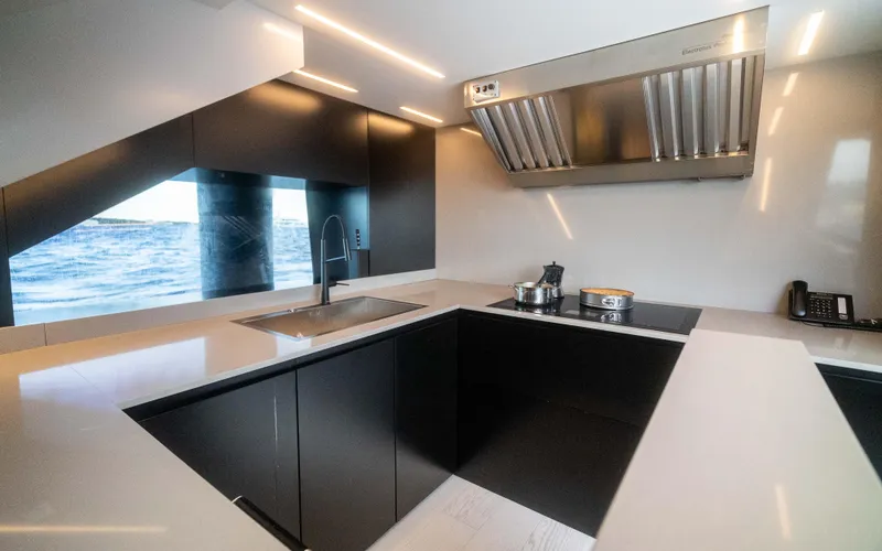 K+ Yacht Photos Pics Modern kitchen interior on Maori M 125 yacht, featuring sleek design and ocean view.