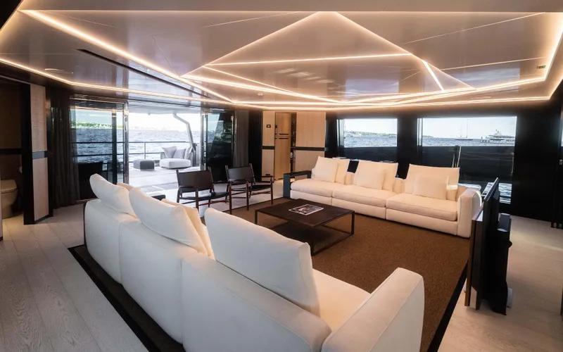 K+ Yacht Photos Pics Luxurious Maori M 125 yacht interior, 2023 model, featuring elegant white sofas and modern lighting.