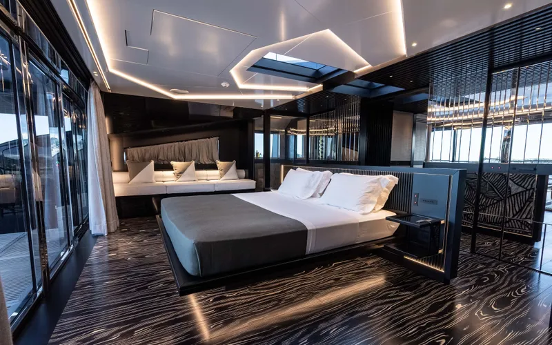 K+ Yacht Photos Pics Luxurious bedroom interior of Maori M 125 yacht, 2023 model, featuring modern design and ambient lighting.