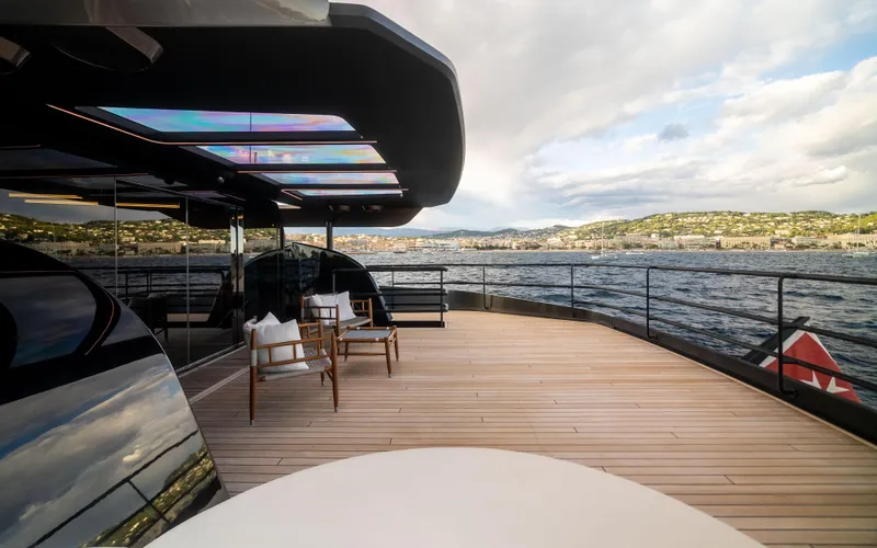 K+ Yacht Photos Pics Luxurious deck of 2023 Maori M 125 yacht with scenic ocean view.