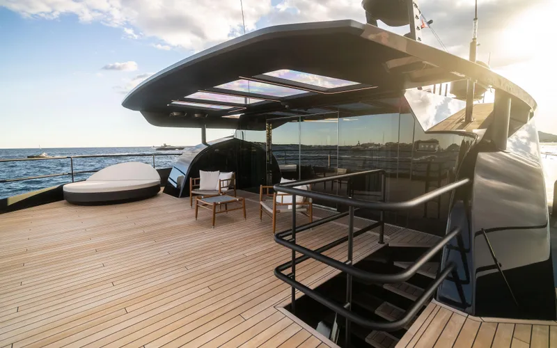 K+ Yacht Photos Pics Luxurious 2023 Maori M 125 yacht deck with modern seating and ocean view.