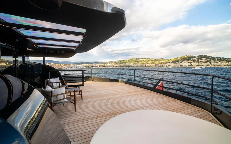 K+ Yacht Photos Pics Luxury deck of 2023 Maori M 125 yacht with scenic ocean view.