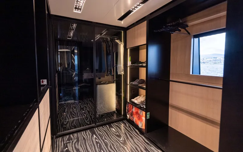 K+ Yacht Photos Pics Luxurious interior of Maori M 125 yacht, featuring sleek design and modern storage solutions.