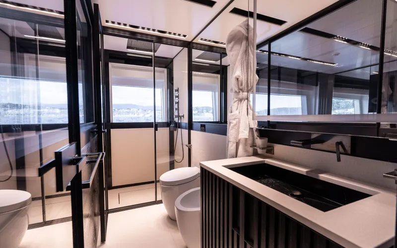K+ Yacht Photos Pics Luxurious modern bathroom on Maori M 125 yacht, featuring sleek design and panoramic windows.