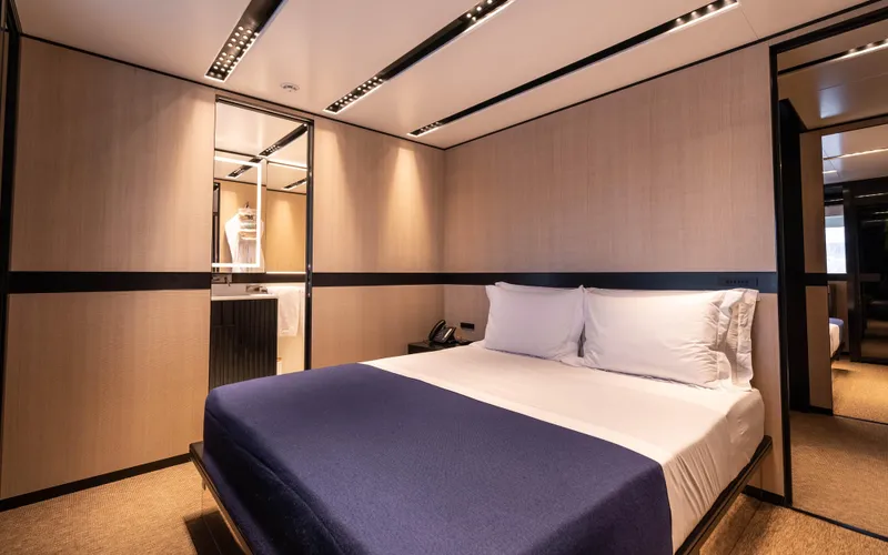 K+ Yacht Photos Pics Luxurious bedroom interior of 2023 Maori M 125 yacht with modern design.