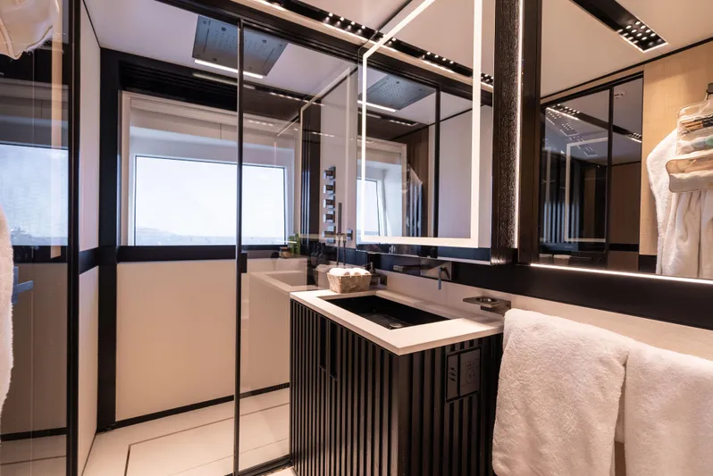 K+ Yacht Photos Pics Luxurious bathroom interior on Maori M 125 yacht, featuring modern design and elegant fixtures.