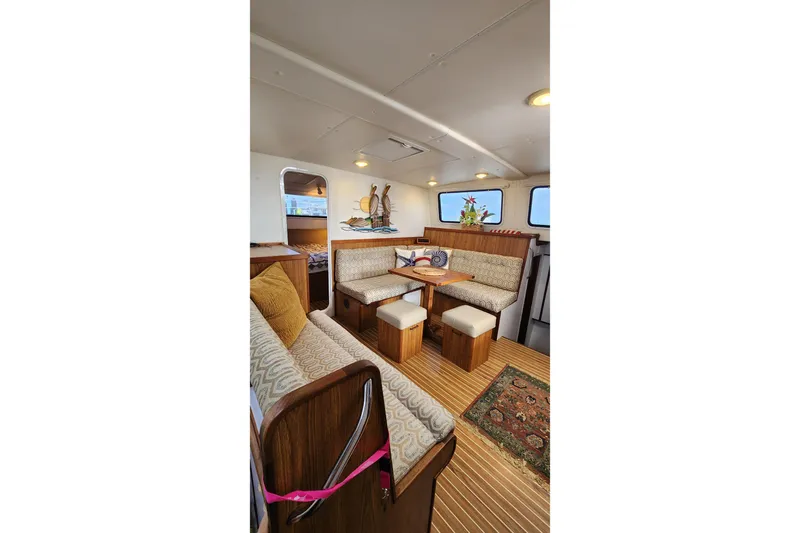Tahawus Yacht Photos Pics Interior of 2005 Endeavour 44 TrawlerCat with cozy seating and wooden accents.