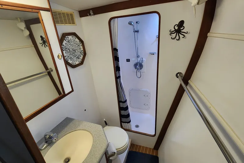 Tahawus Yacht Photos Pics Bathroom interior of 2005 Endeavour 44 TrawlerCat with shower and nautical decor.