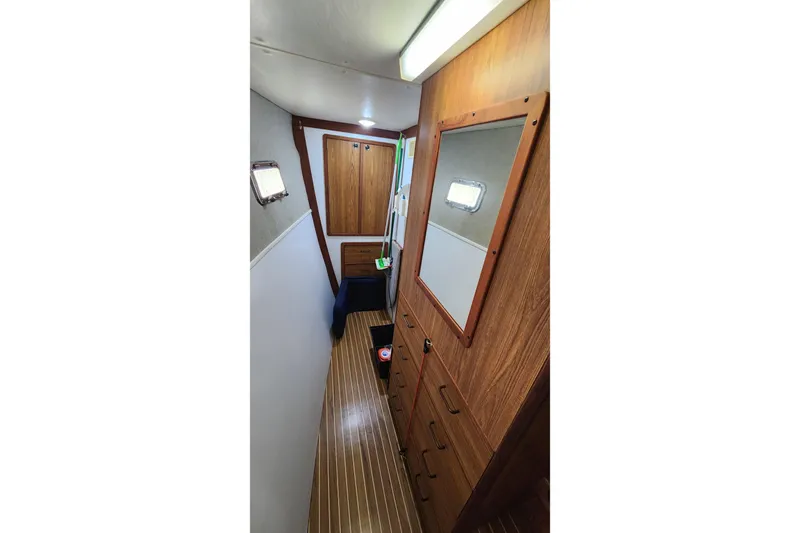 Tahawus Yacht Photos Pics Interior of 2005 Endeavour 44 TrawlerCat with wood paneling and storage cabinets.
