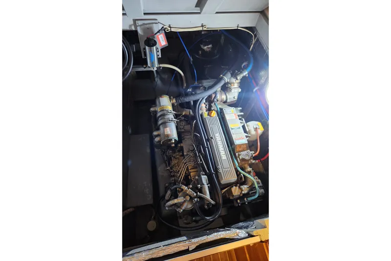 Tahawus Yacht Photos Pics Engine compartment of a 2005 Endeavour 44 TrawlerCat, showcasing mechanical components.