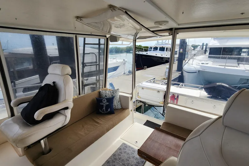 Tahawus Yacht Photos Pics Interior of 2005 Endeavour 44 TrawlerCat with seating, nautical decor, and marina view.