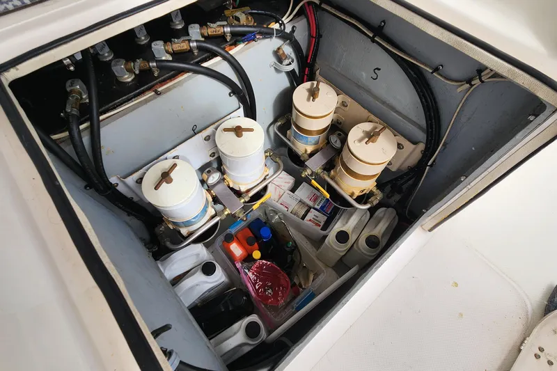 Tahawus Yacht Photos Pics Engine compartment of a 2005 Endeavour 44 TrawlerCat with filters and maintenance supplies.