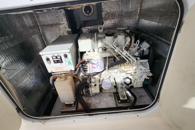 Tahawus Yacht Photos Pics Engine compartment of a 2005 Endeavour 44 TrawlerCat, showcasing mechanical components.