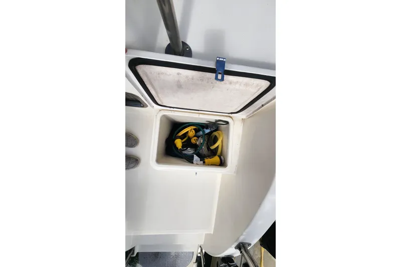 Tahawus Yacht Photos Pics Storage compartment on 2005 Endeavour 44 TrawlerCat with cables and equipment.