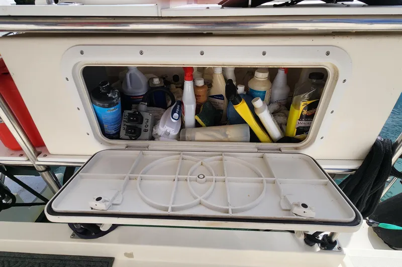 Tahawus Yacht Photos Pics Storage compartment on 2005 Endeavour 44 TrawlerCat filled with cleaning supplies and tools.