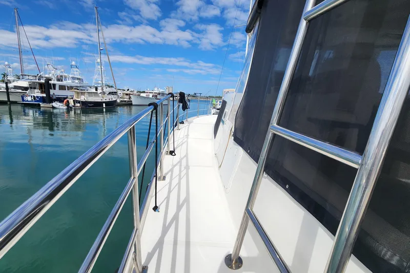 Tahawus Yacht Photos Pics 2005 Endeavour 44 TrawlerCat docked at marina under blue sky.