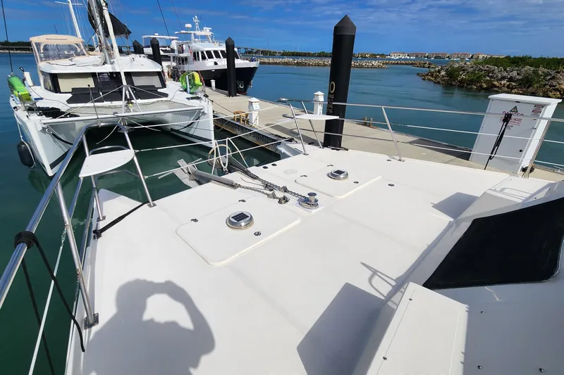 Tahawus Yacht Photos Pics 2005 Endeavour 44 TrawlerCat docked at marina, clear sky, calm waters.
