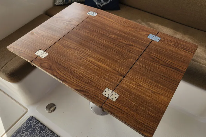 Tahawus Yacht Photos Pics Wooden table with metal hinges on Endeavour 44 TrawlerCat, 2005 model.