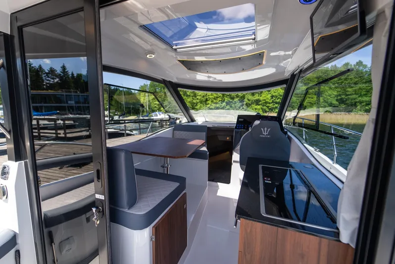  Yacht Photos Pics Interior of 2025 Nautic 880 boat with modern design and panoramic windows.