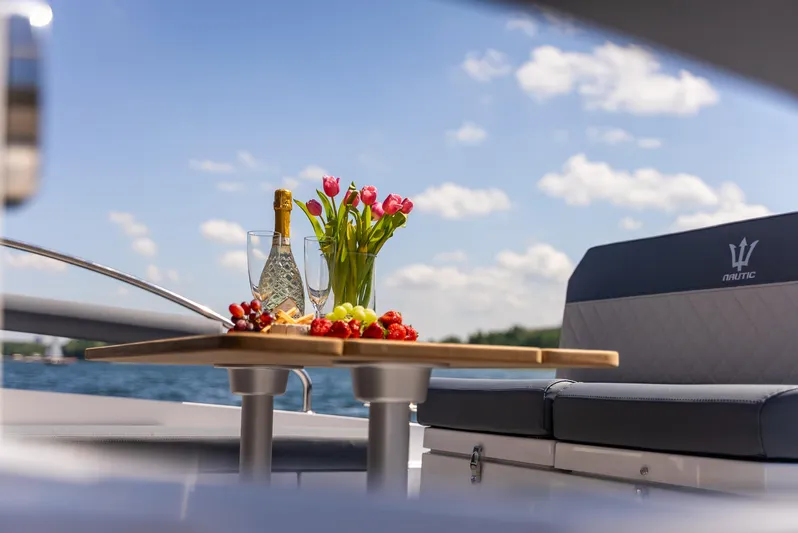  Yacht Photos Pics Luxury Nautic 880 yacht with champagne, flowers, and fruit on deck, 2025 model.