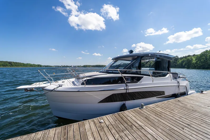  Yacht Photos Pics Modern Nautic 880 boat docked on a sunny day, 2025 model.