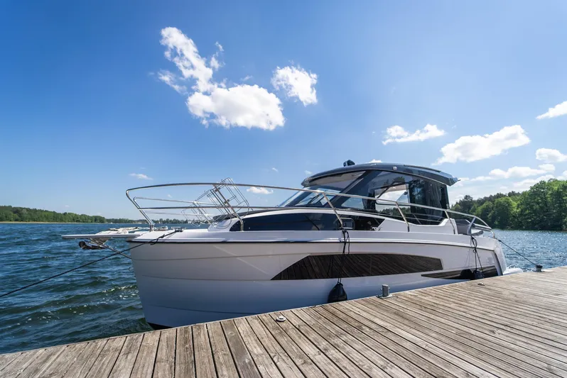 Yacht Photos Pics Modern Nautic 880 boat docked on a sunny day, 2025 model.