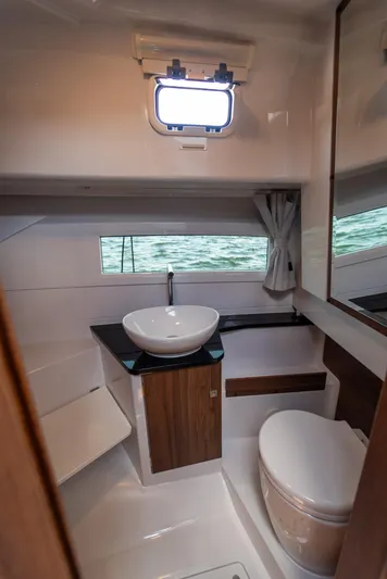  Yacht Photos Pics Modern bathroom interior of 2025 Nautic 880 boat with sink and toilet.