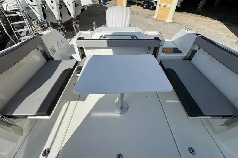  Yacht Photos Pics 2026 Jeanneau NC Sport 795 Series 2 boat interior with seating and table.