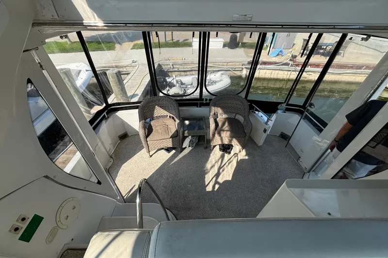  Yacht Photos Pics 2002 Carver 444 Cockpit Motor Yacht interior with seating and waterfront view.