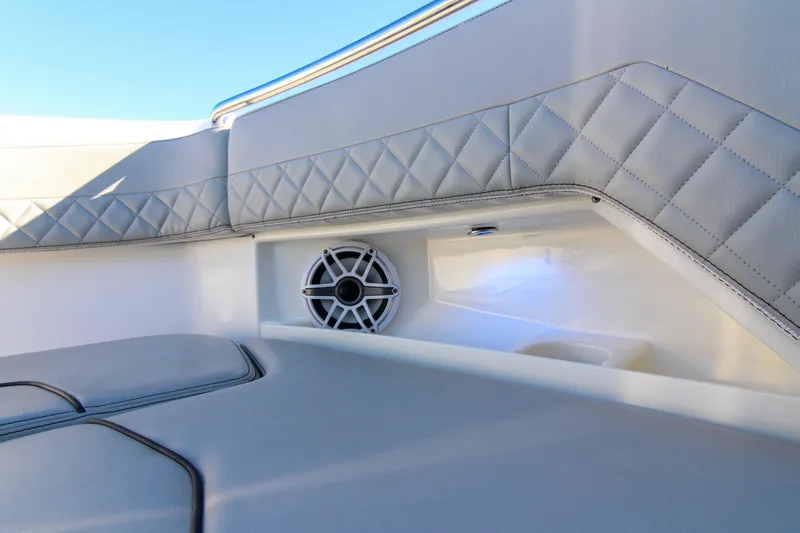 Endeavor Yacht Photos Pics Luxurious interior of 2023 Pursuit DC 295 Dual Console with quilted upholstery and speaker.