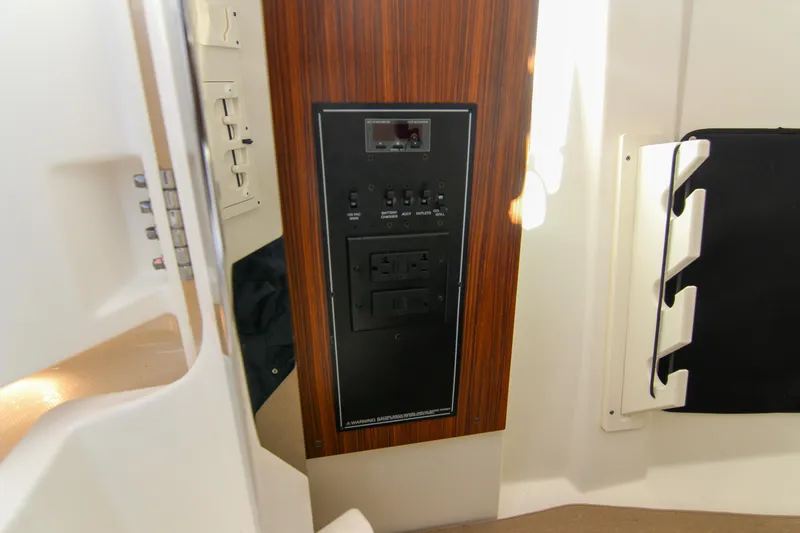 Endeavor Yacht Photos Pics 2023 Pursuit DC 295 Dual Console interior control panel with wood finish.